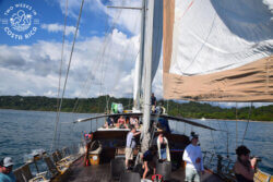 sailboat with several people onboard