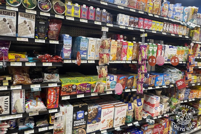 Grocery store shelf in Costa Rica with assorted food items